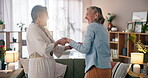 Lesbian, couple and happy with dancing in house for bonding, favorite song and radio playlist. Lgbtq, people and holding hands with rhythm, audio track and music entertainment in living room of home