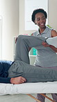 Woman, physiotherapist and patient with stretching for knee pain, recovery or injury at wellness clinic. People, physical therapy and help for rehabilitation, smile or progress for muscle development