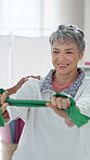 Senior woman, physiotherapy and resistance band with support for recovery, exercise and muscle development. Elderly patient, physiotherapist and rehabilitation for fitness, injury and happy at clinic