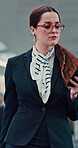 Woman, flight attendant and walking with texting on smartphone at airport for departure. Female person, employee and networking with message, notification and social media post as air hostess 