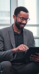 Business, black man and smile by typing on tablet for project research, update schedule and reading report. African, male person and glasses with digital to review email, feedback information and app