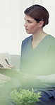 Nurse, clipboard and writing notes in home for patient report, results or healthcare information. Caregiver, checklist and medical professional or woman in lounge with schedule, insurance or listen
