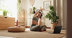 Woman, yoga and laptop with stretching in home, floor and breathe with mindfulness for online course . Girl, person and computer in morning with zen balance, chakra and wellness in lounge at house