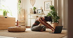 Laptop, yoga and woman with stretching in home on floor for mindfulness with online tutorial. Health, breathing and person with pilates exercise on computer in morning for zen, balance and wellness.