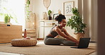 Woman, yoga and laptop with stretching on floor, home and breathe with mindfulness for online course . Girl, person and computer in morning with zen balance, chakra and wellness in lounge at house