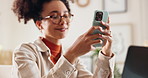 Home, laptop and woman with smartphone for typing, text message and conversation with online contact. Female person, reading and smile with mobile app for comment, social media and chat in apartment