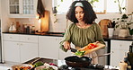 Kitchen, woman and pan with vegetables for frying, cooking and preparation for healthy diet at home. Culinary, female person or cook with food after cutting, chop and nutrition meal with peppers