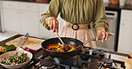 Food, cooking and hands of woman in kitchen with peppers for ingredients with nutrition and wellness. Pan, groceries and closeup of female person preparing healthy, diet or vitamins dinner in home.