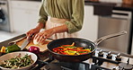 Home, hands and woman with onion for cutting, chop and preparation for healthy diet in kitchen. Culinary, female person and nutrition with food for cooking, frying and vegetables meal with peppers