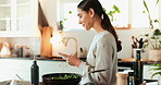 Woman, typing and cooking with phone in kitchen for text message, search online recipe and meal ingredients. Person, happy or smartphone for food subscription app, social media scroll or blog in home