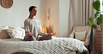 Yoga, woman and lotus in bedroom for meditation, peace and wellness on bed. Fitness person, zen and healthy body in home for spiritual healing, positive mental health or calm to align chakra for care