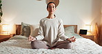 Calm woman, bed and yoga with meditation for zen, awareness or spiritual wellness at home. Young, female person or yogi in relax or lotus pose for exercise, health and wellbeing in bedroom at house