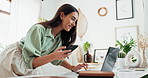 Businesswoman, phone and laptop with plants in office for blog post review, checking magazine article and garden writer. Eco friendly startup, tech or happy for web story on biodiversity conservation