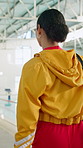 Back, woman and teacher for swimming sport of fitness class, aquatic learning and water exercise at pool. Female coach, lifeguard and swimmer safety with wellness performance for student development