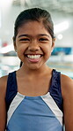 Face, smile and girl with swimming at school for sports fitness, aquatic learning and water exercise at pool. Happy, child and portrait with swimmer talent, wellness performance and skill development