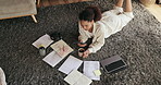 Woman, student and phone with documents on floor for planning, social media and coffee with research for thesis. Person, girl and smartphone for chat, drink and above for elearning on carpet in home