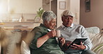 Senior couple, tablet and coffee on sofa with talk, search or relax with reading review for movie in home. Elderly woman, old man and digital touchscreen with app for video, streaming or subscription