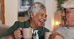 Senior couple, coffee and toast on sofa with laugh, connection and bonding with cheers in home. Woman, man and relax with drink, celebration and smile with memory on living room couch in retirement