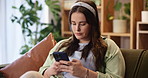 Home, bored and woman on sofa, smartphone and typing with message to contact, network and stress. Cellphone, person or girl on couch, mobile game and online reading with break, chatting or connection