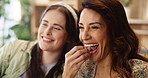 Friends, laugh and popcorn in house for movie, television and streaming online video with subscription. Women, bored and eating snack in living room for watching tv, bonding and relax with blanket