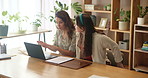 Women, documents and laptop on table in home for online booking, notes and progress on passport. Friends, conversation and notebook with tech in house for travel schedule, itinerary and reading info