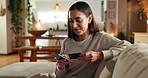 Woman, credit card and smartphone on sofa, happy and reading info for payment, bills or ecommerce. Person, phone and smile with fintech, banking and easy transaction with mobile app in living room