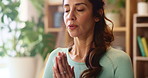 Woman, namaste hands and meditation in home with breathing exercise, balance or mindfulness. Person, peace and wellness with zen, health and yoga on floor with awareness in morning at apartment