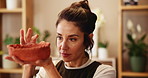Woman, pottery and work in studio as creative artist for project, home decor or handmade craft. Female person, serious and clay in gallery for small business, workshop or sculpture in interior design