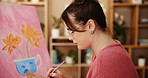 Color, painting and artist with woman in studio for drawing, brush and inspiration. Calm, painter hobby and creative with person and canvas in home workshop for design, fineart project and artwork