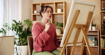 Brush, painting and thinking with woman in studio for artist, creative and inspiration. Calm, painter hobby and color with person and canvas in home workshop for design, project and reflection. 
