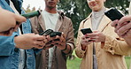 People, students and hands with phone in nature for chatting, social media or data sync at outdoor park. Closeup, young or group of friends with mobile smartphone for communication or connection