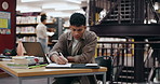 Student, writing and man in library, laptop and typing with education, university and planning. College, person and guy with computer, studying and research for project, knowledge and problem solving