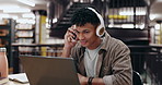 Student, music and man reading on laptop in library for education, university and knowledge. College, headphones and person on technology for studying research for project assignment and assessment