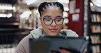 Black woman, student or library with tablet for research, assignment or project at university. Young African, female person or learner with technology or glasses for reading, application or elearning