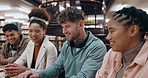 Students, talking or happy in library for education, team project or feedback with research. Study group, people or tech in university for collaboration, information and workshop for productivity