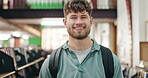 Man, face and smile with backpack in library for higher education, knowledge and academic books. Happy, student and confident at university campus for scholarship, literature and learning at academy