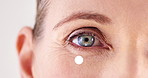 Antiaging, eye and skincare with mature woman closeup in studio for cosmetic beauty treatment. Face, special effects and zoom with wrinkles of person on white background for collagen or dermatology