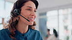 Woman, face and talking in call center for customer service, telemarketing and FAQ in office. Agent, smile and headset at help desk for friendly service, consulting and technical support with tech