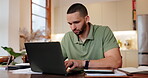 House, man and laptop with paperwork at table for financial payment, loan bills and bank statement. Male person,  and technology with documents for credit card debt, invoice or online account at home