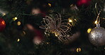 Lights, tree and decoration for Christmas, celebration and holiday aesthetic in house with ornaments. Flower, festive and vacation season in apartment for merry Xmas, party or event with sparkle ball