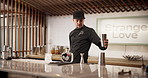 Man, ice and bartender with tricks at restaurant for cocktail for service, hospitality or catering. Skill, waiter and male mixologist prepare drink for order at social lounge or pub for happy hour.