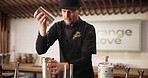 Man, bartender and cocktail shaker for alcohol preparation, beverage drip or mixology process. Pub, mixer or barman shaking drink ingredients for professional service, tricks or catering at nightclub