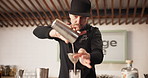 Man, alcohol and bartender at restaurant with cocktail for service, hospitality or catering. Strainer, waiter and male mixologist prepare drink for order at social lounge, club or pub for happy hour.