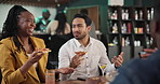 Friends, talking and happy people eating pizza at pub for party or celebrate new year. Group, fast food and social gathering at restaurant with cocktail, relax and laugh at funny discussion together