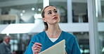 Walking, nurse or woman in hospital with chart, inspection and notes for healthcare management. Writing, admin and medical professional in lobby with folder, checklist or schedule planning for clinic