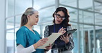 Woman, nurse and hospital manager with chart, tablet and discussion for healthcare schedule together in lobby. Planning, funding and doctor in clinic consulting health insurance agent on digital app