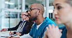Man, doctors and writing notes at conference with listening, audience and global seminar for monkeypox. People, group and crowd with notebook, presentation and info at meeting in hospital boardroom