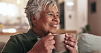 Coffee, happy and senior woman on sofa with drink for relaxing, chill and peace in home. Retirement, smile and mature person with mug for tea, warm beverage and latte for wellness in living room