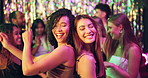 Friends, women and energy with dancing at nightclub for disco event, laughing and fun together. Group, crowd and dancefloor with smile, bonding and celebration with entertainment and social gathering