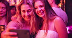 Selfie, friends and night with women in club for new years eve party, celebration and concert. Neon, profile picture and music with people on dance floor for memory, social event and festival